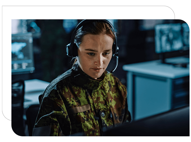 Military woman in uniform is talking on headset in an office