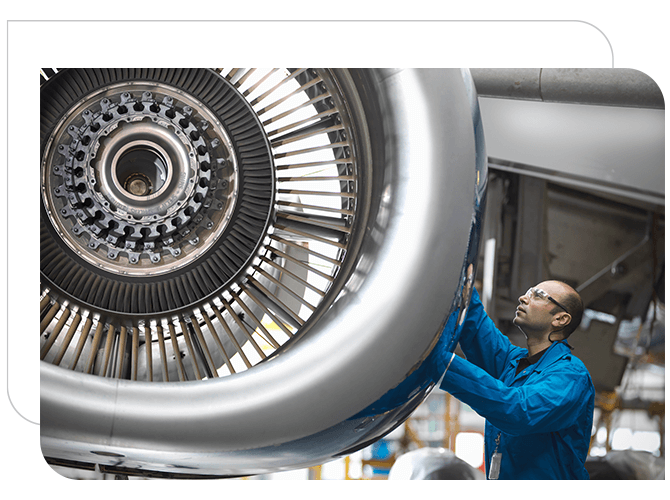 An aircraft engineer checking the aircraft wheels.