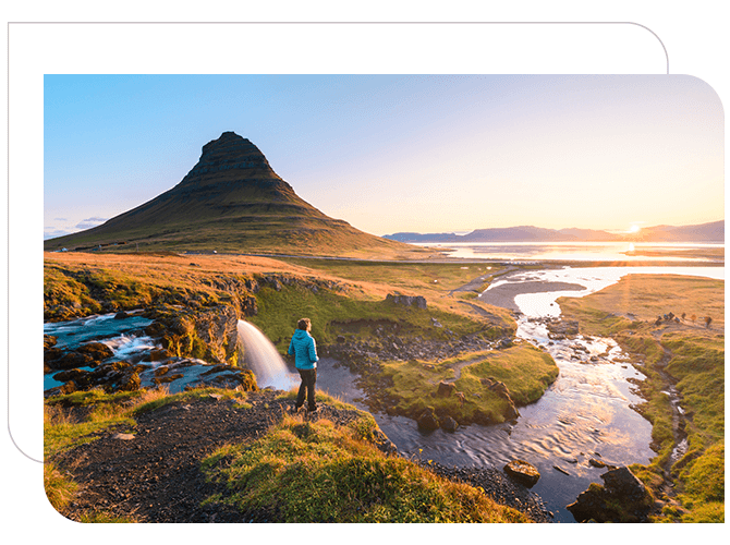 A man enjoying the sunset in the mountain.