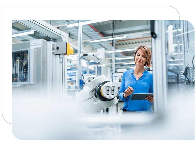 woman monitoring manufacturing equipment