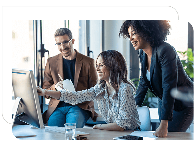 A team is watching laptop and discussing related to work