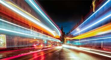 Time-lapse photography of city roads at night.