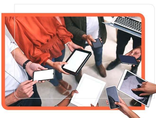 Group of employees using mobiles, Tablet and Laptop.