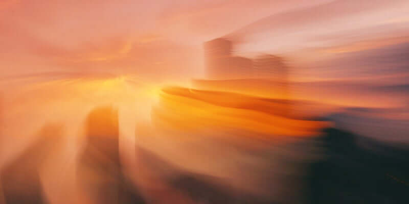 Buildings are blur with sunlight.