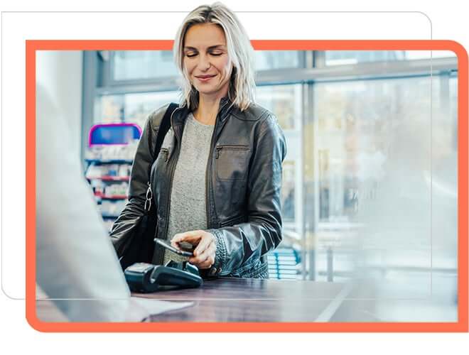 Customer paying bill using mobile in shopping mall.