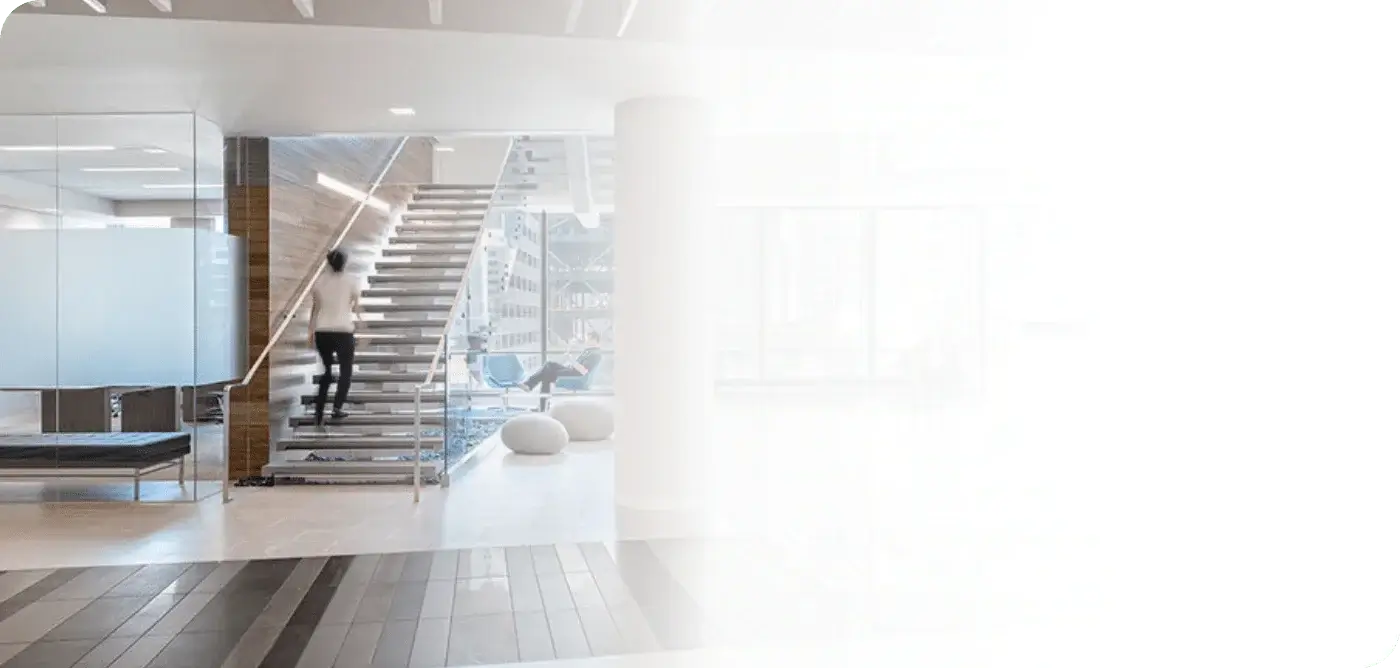 Women climbing stairs in office