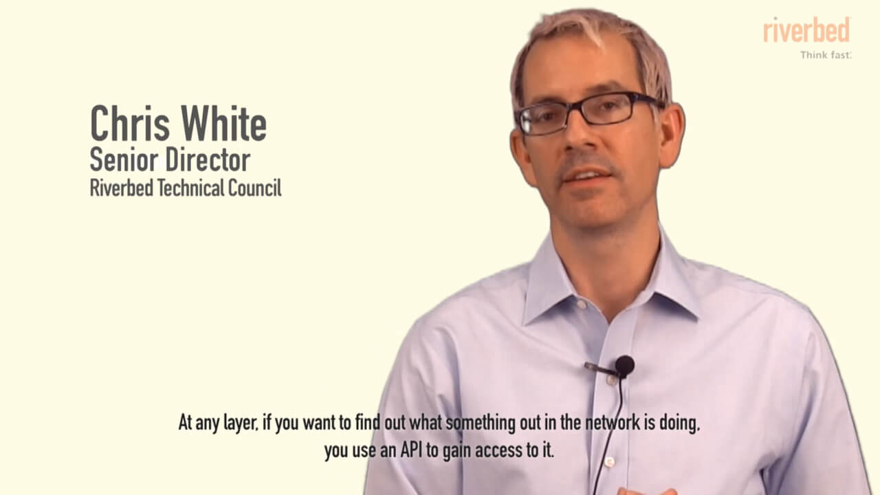 senior director chris white in pale yellow background explaining about network