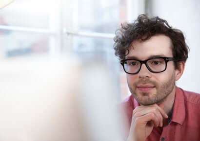 man in office behind
