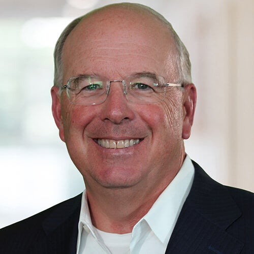 Dave Donatelli headshot, smiling executive