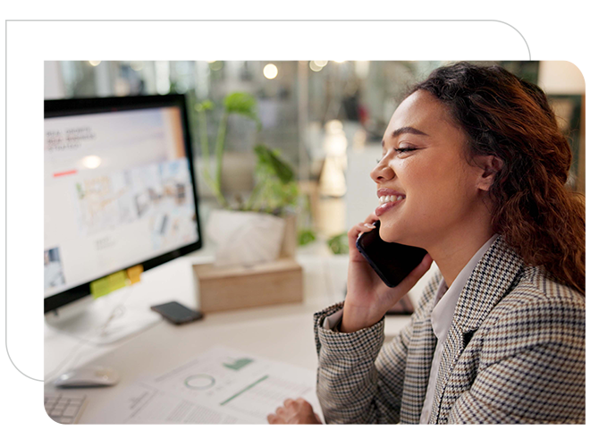 lady discussing business using mobile and desktop