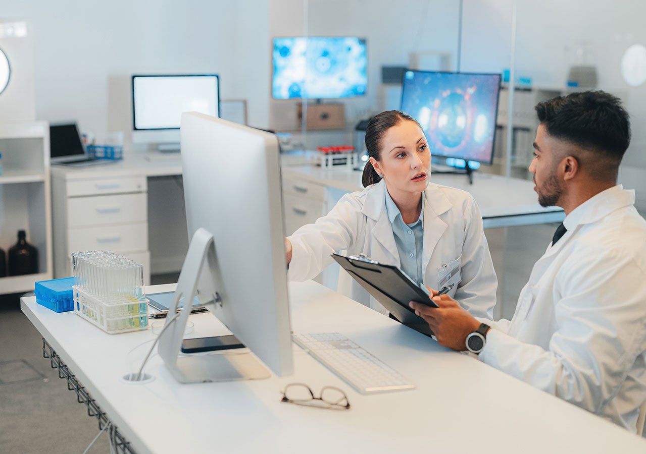 Doctor, scientist or healthcare employee writing, research and planning creative innovation surgery strategy. Collaboration, teamwork and meeting and working on idea online, web or internet in lab