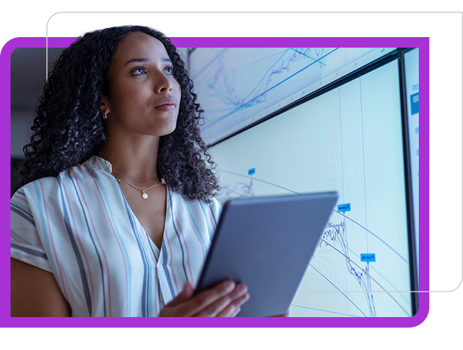 The women watching the graph on big screen