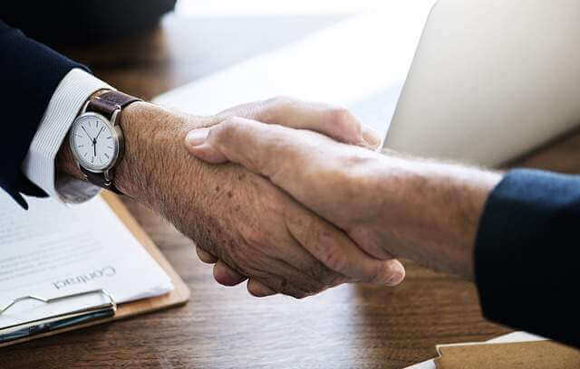 close up hand shake of two business people