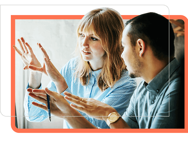 business continuity, man and woman looking at screen in conversation