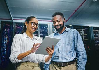 man and woman in server room talking