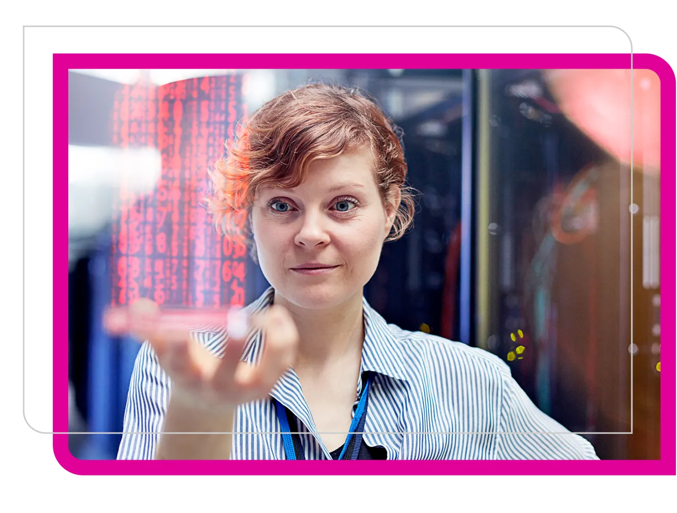 Female IT technician holding futuristic digital tablet in server room